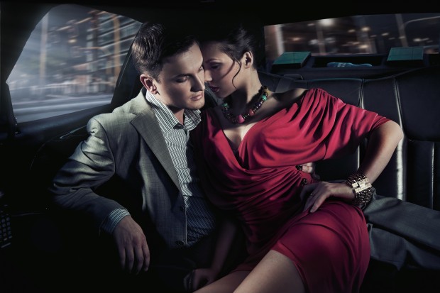 Sexy sitting couple in car